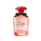 Dolce & Gabbana perfume bottle with red flower cap on a white background