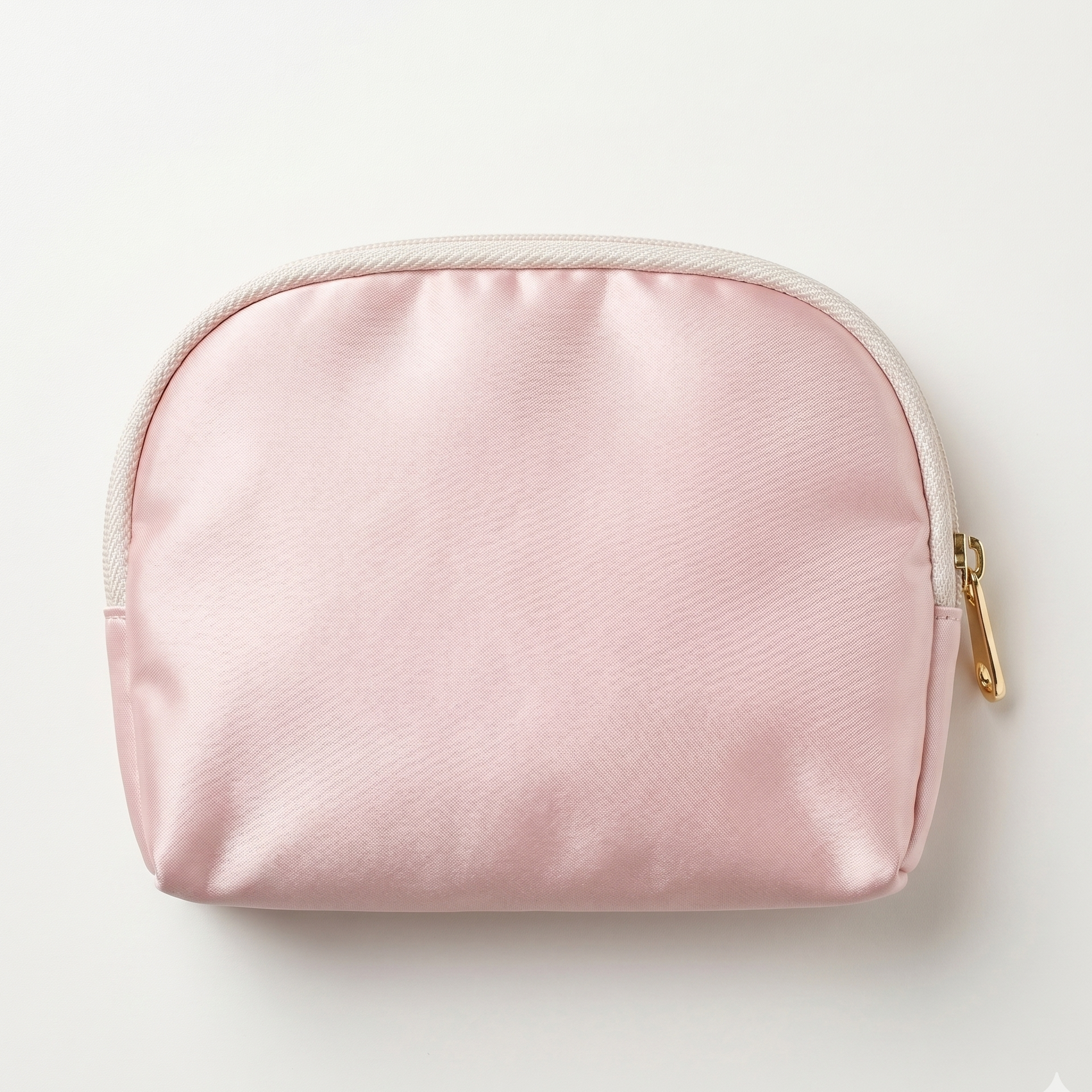 Pink cosmetic bag with gold zipper on a light gray background